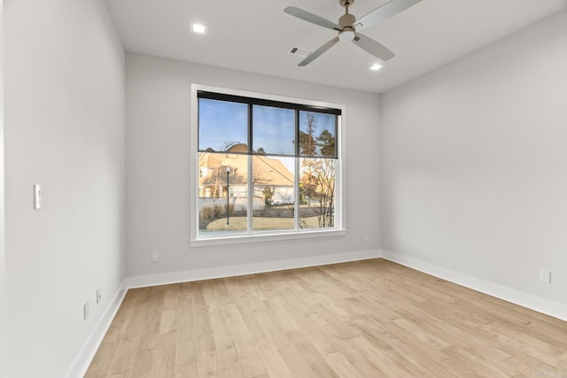 empty room with light hardwood / wood-style flooring and ceiling fan