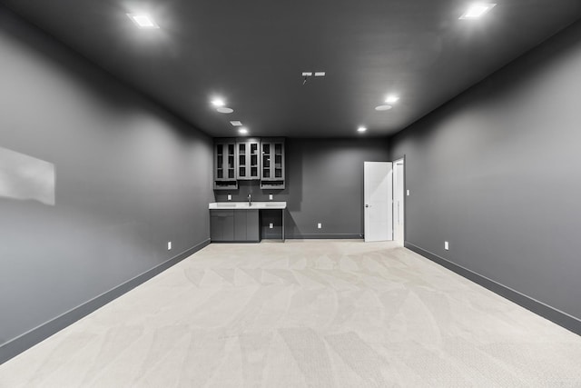 bar with light carpet and sink