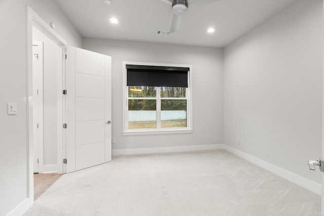 carpeted empty room with ceiling fan