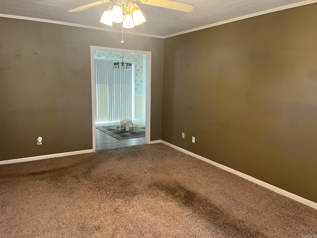 unfurnished room with carpet flooring, ceiling fan, and ornamental molding