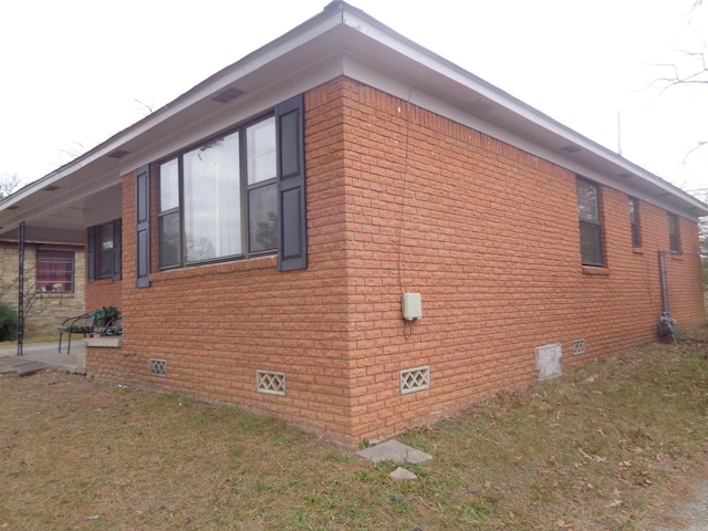 view of home's exterior with a lawn