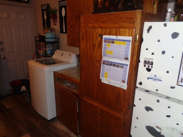 laundry room featuring hardwood / wood-style floors and washer / clothes dryer