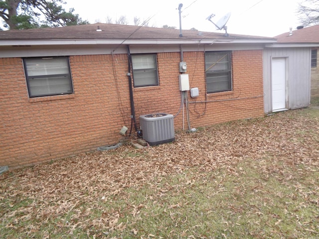 view of side of property with central AC