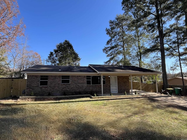 back of house featuring a yard