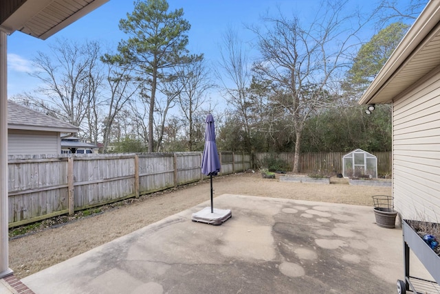 view of patio with a storage unit