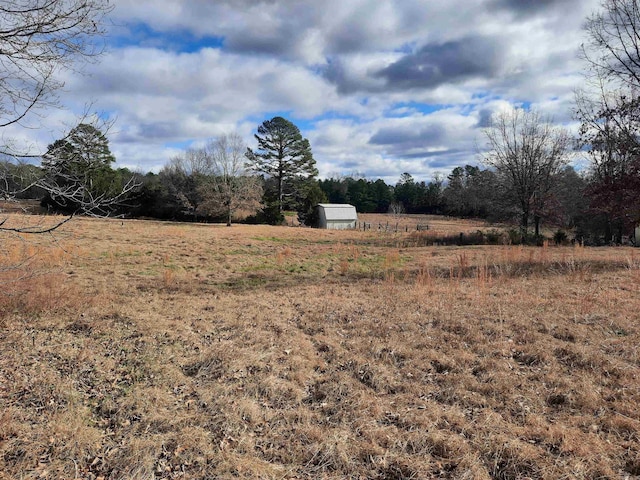 view of yard with a rural view