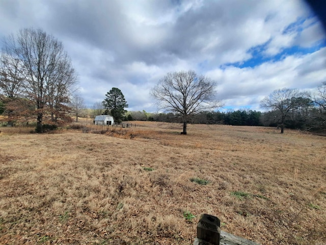 view of yard with a rural view