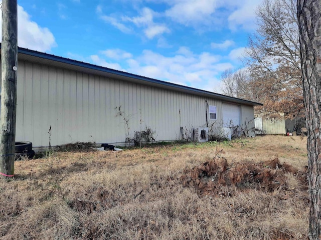 view of side of property with a garage