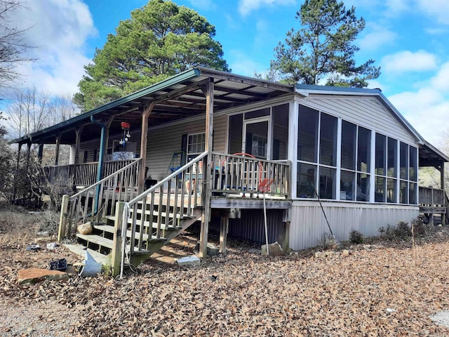 exterior space featuring a sunroom