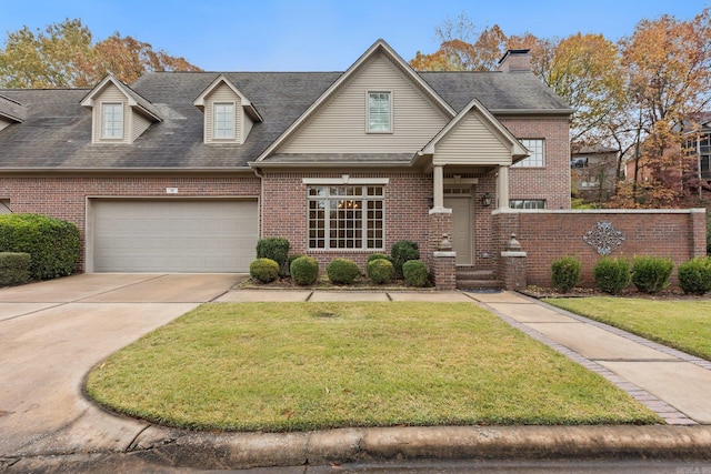 view of front of home featuring a garage and a front yard