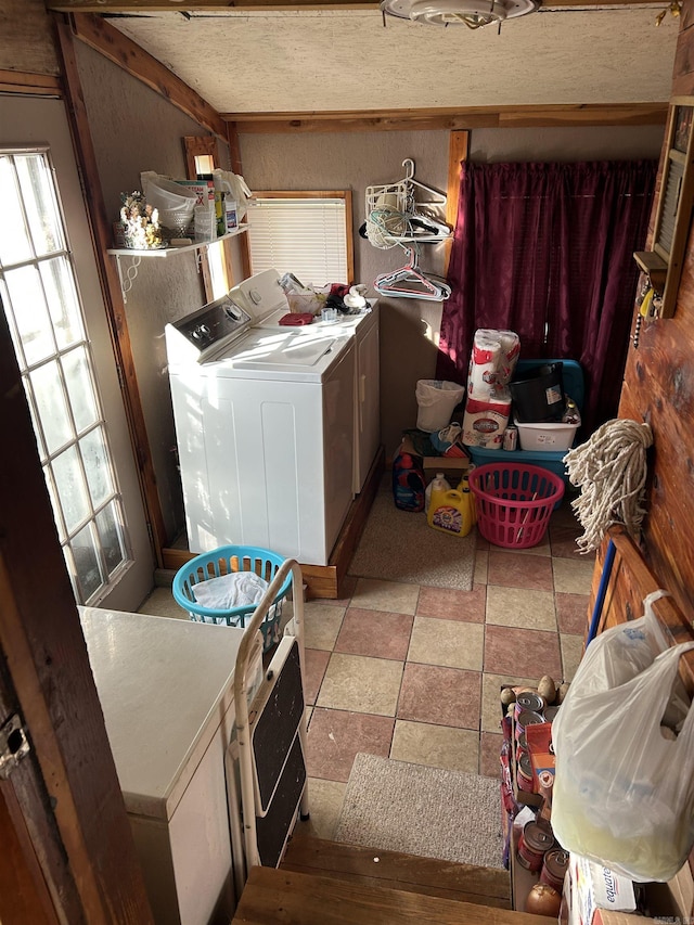 clothes washing area with separate washer and dryer