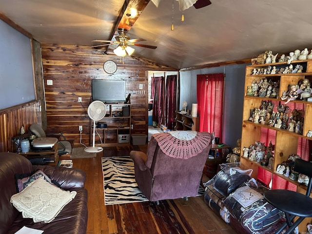 living room featuring hardwood / wood-style floors, ceiling fan, wood walls, and vaulted ceiling