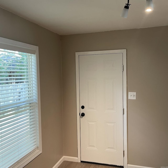 entryway with hardwood / wood-style floors