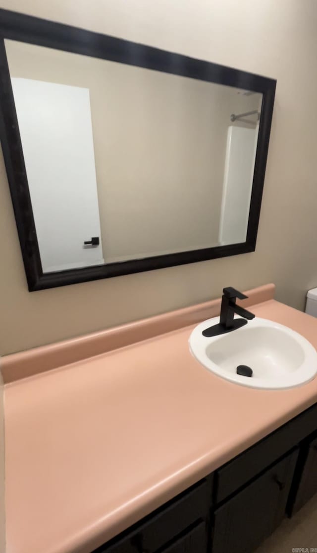 bathroom with vanity and toilet