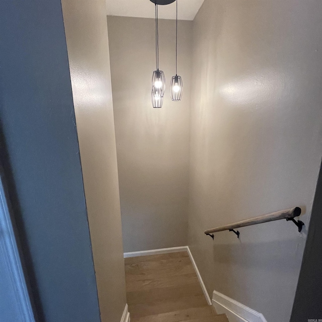 stairway featuring hardwood / wood-style floors