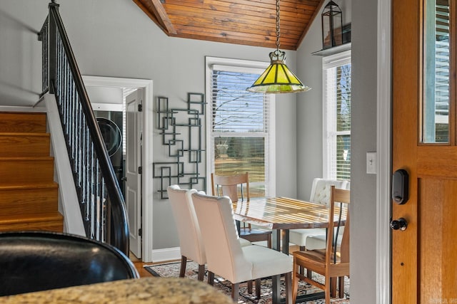 dining room with lofted ceiling and wood ceiling