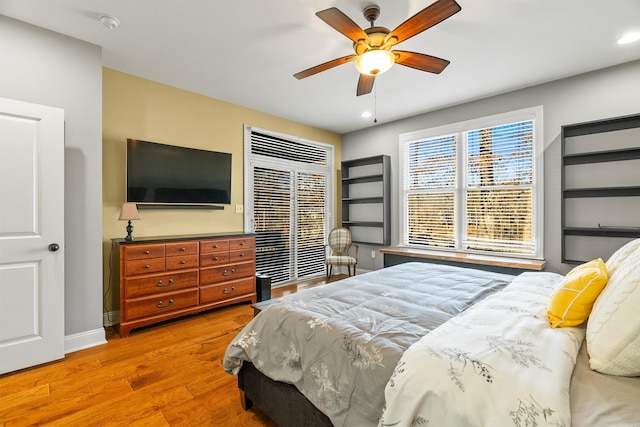 bedroom with ceiling fan and light wood-type flooring