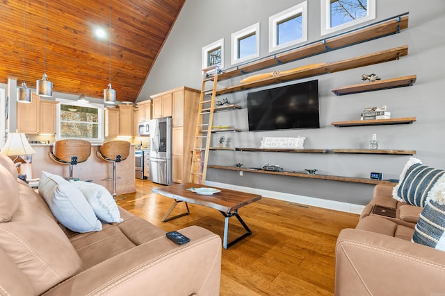 living room with wooden ceiling, high vaulted ceiling, and light hardwood / wood-style flooring