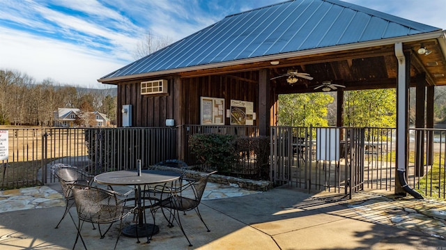 view of patio featuring ceiling fan