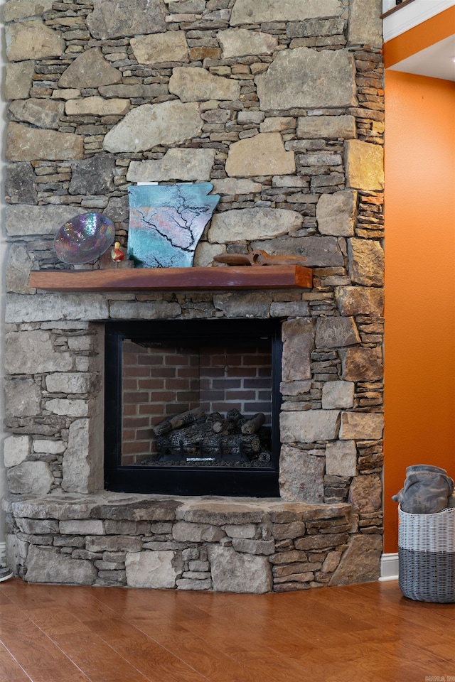 room details featuring a fireplace and hardwood / wood-style floors