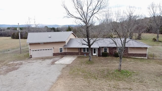 view of front of property featuring a mountain view and a garage