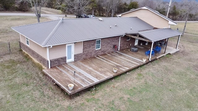 back of house with a wooden deck