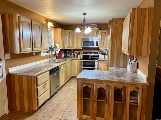 kitchen featuring pendant lighting, sink, light brown cabinetry, light tile patterned flooring, and stainless steel appliances