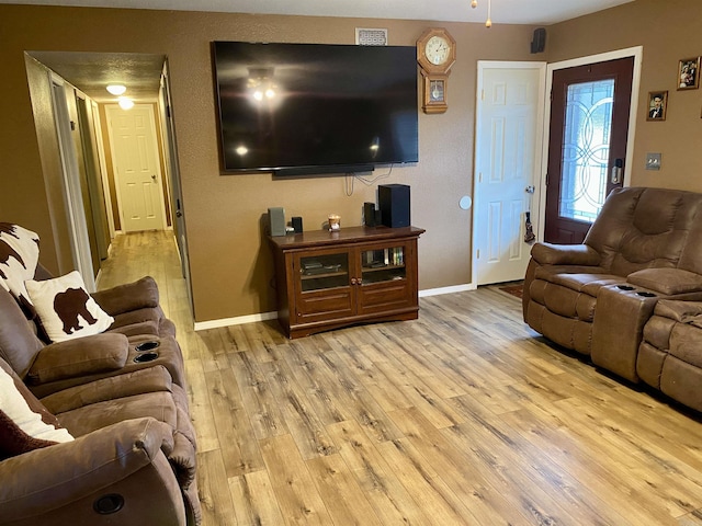 living room with light hardwood / wood-style flooring