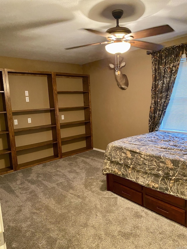 unfurnished bedroom featuring carpet flooring and ceiling fan