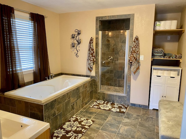 bathroom with vanity and separate shower and tub