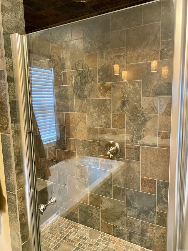 bathroom featuring an enclosed shower