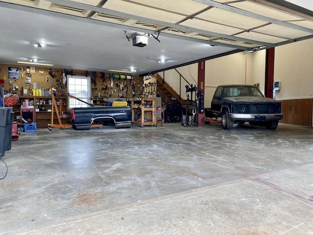 garage featuring a workshop area and a garage door opener