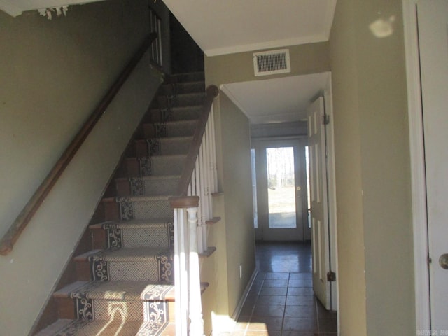 stairs featuring tile patterned flooring