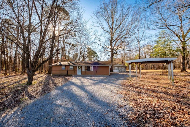 ranch-style home with a carport