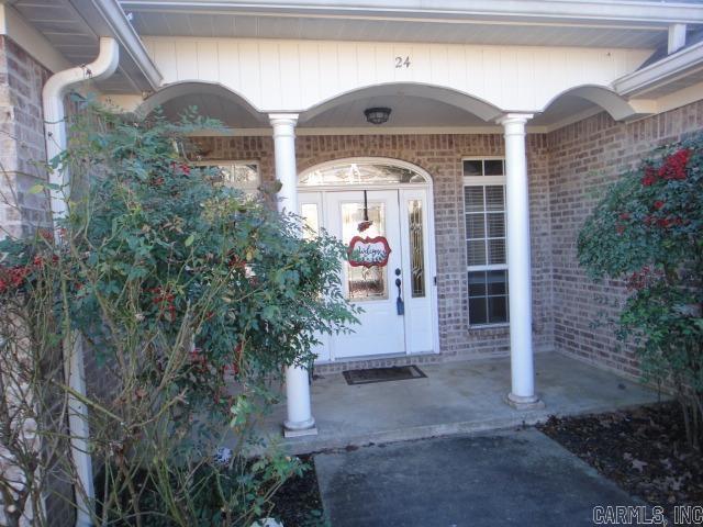 view of exterior entry featuring a porch