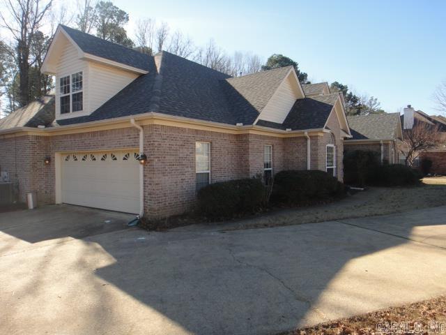 view of side of property with a garage