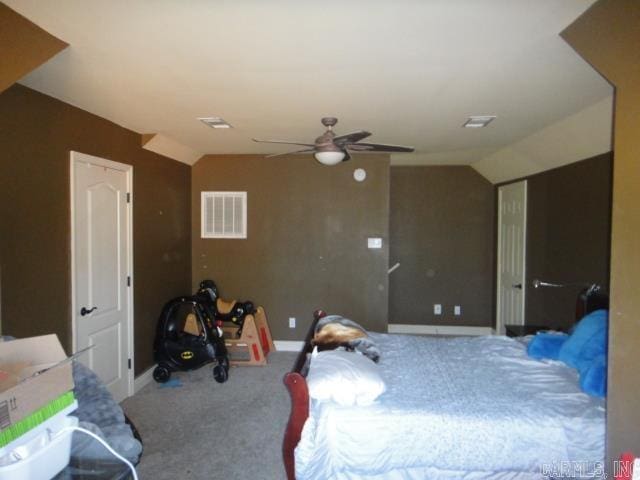 carpeted bedroom with ceiling fan and lofted ceiling