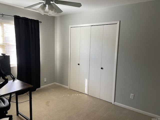 office area with light colored carpet and ceiling fan