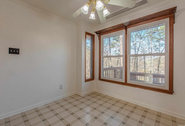 spare room with ceiling fan, a healthy amount of sunlight, and ornamental molding