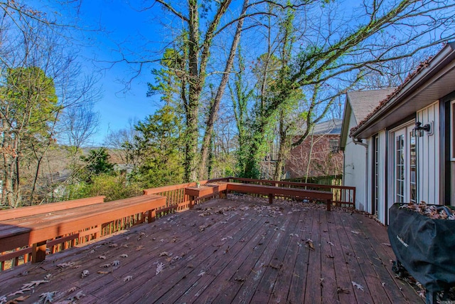 wooden terrace with area for grilling