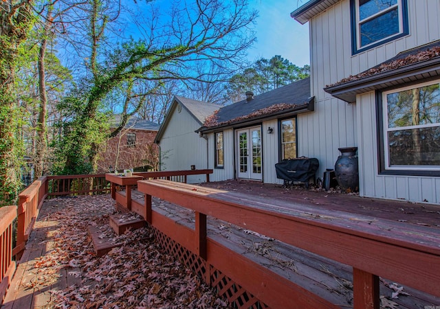 wooden deck featuring area for grilling and french doors