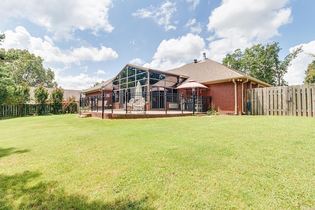 back of house featuring a gazebo and a lawn