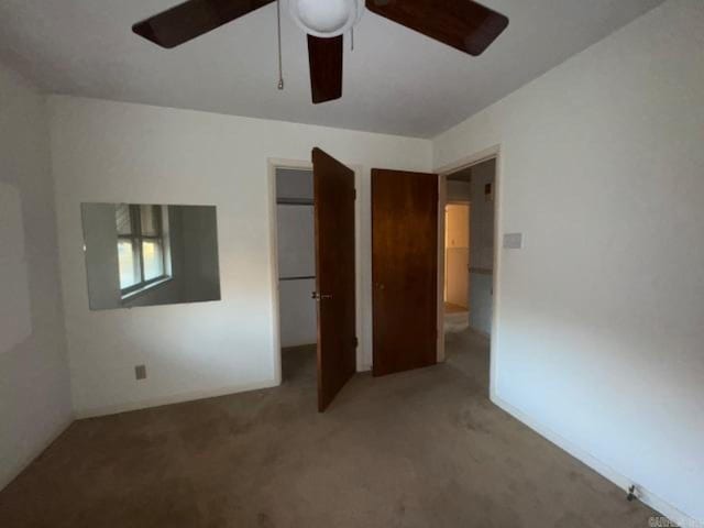 unfurnished bedroom featuring carpet flooring and ceiling fan