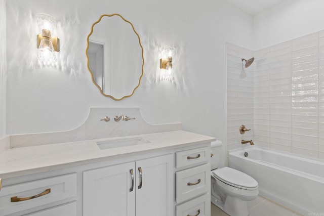 full bathroom with tile patterned floors, vanity, tiled shower / bath combo, and toilet