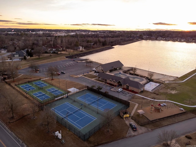 aerial view at dusk with a water view