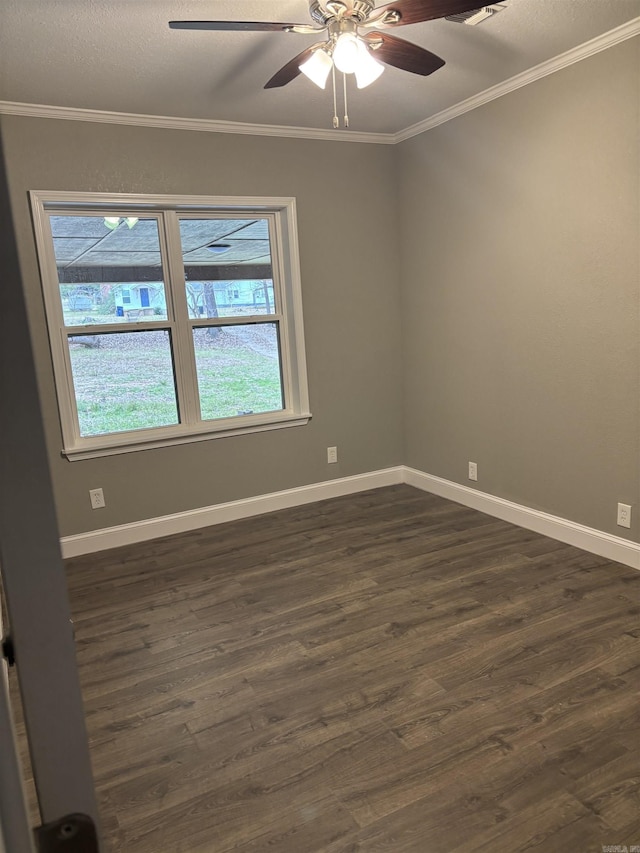 empty room with dark hardwood / wood-style flooring, ceiling fan, and crown molding