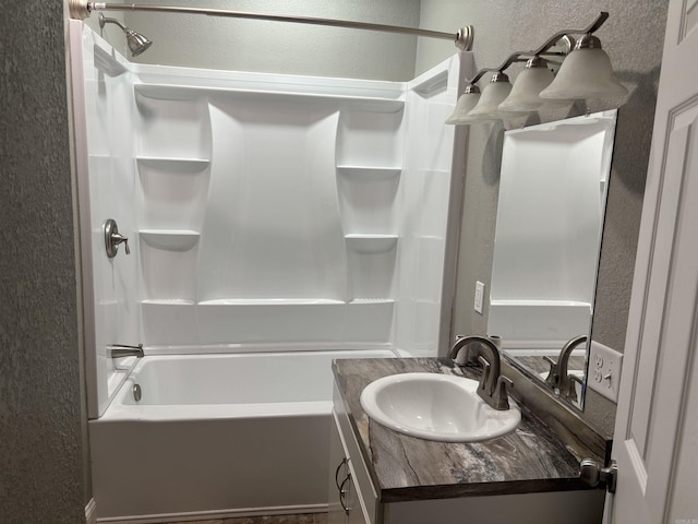 bathroom featuring vanity and shower / bathtub combination