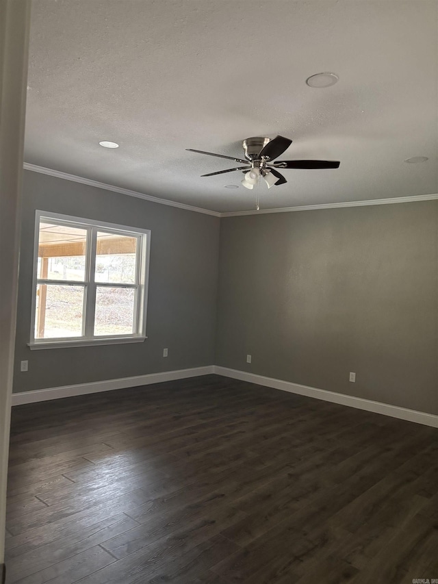 empty room featuring dark hardwood / wood-style flooring, ceiling fan, and crown molding