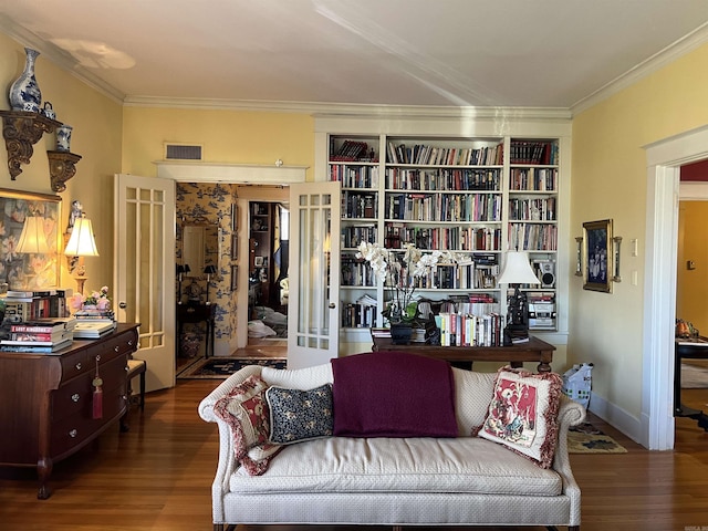 sitting room featuring dark hardwood / wood-style flooring, french doors, and ornamental molding