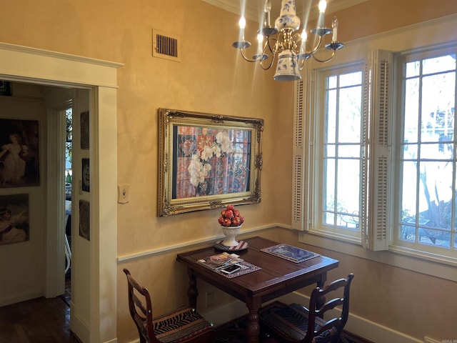 dining room featuring a chandelier and ornamental molding